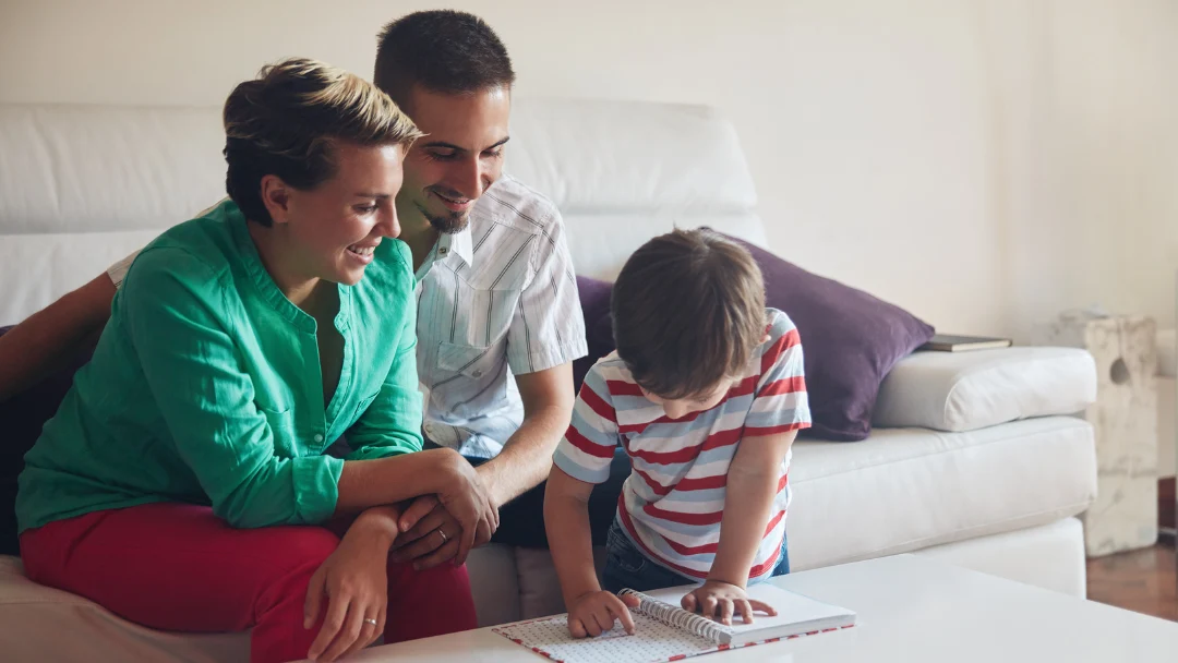 A family supporting a child’s learning at home
